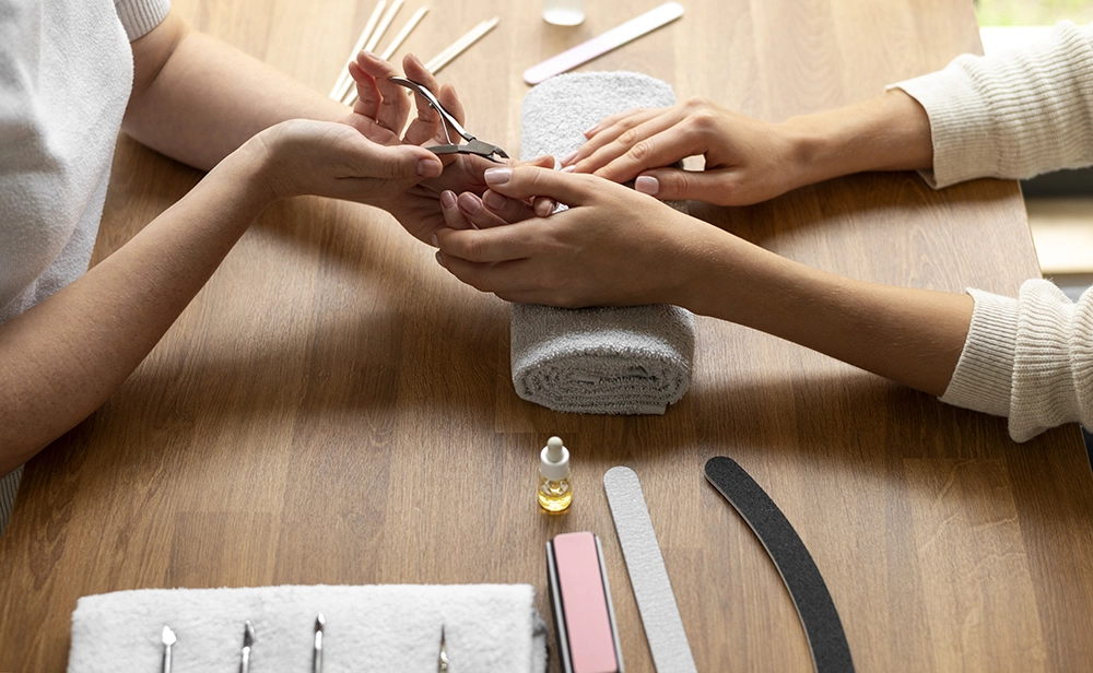 close-up-woman-getting-manicure-done